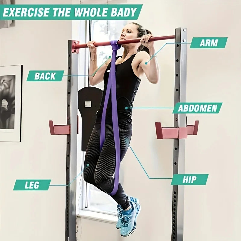 Woman performing assisted pull-up with purple resistance band showing full body workout targeting arms, back, abdomen, hip and leg muscles