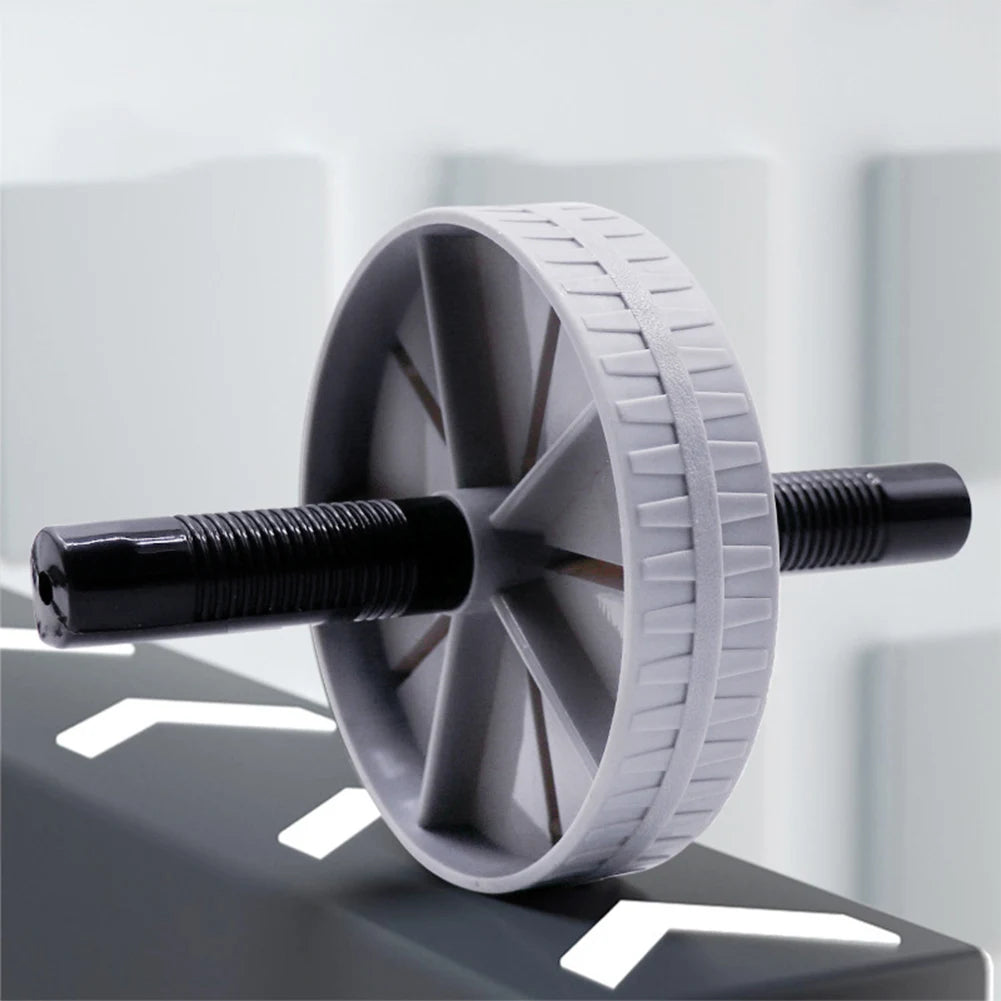 Wide-base ab training wheel with textured non-slip tread and ergonomic black foam handles for stable core workouts
