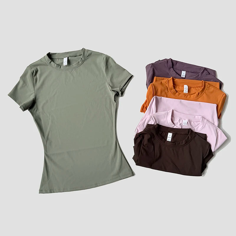 Seamless workout tees in multiple colors including green, purple, orange and pink