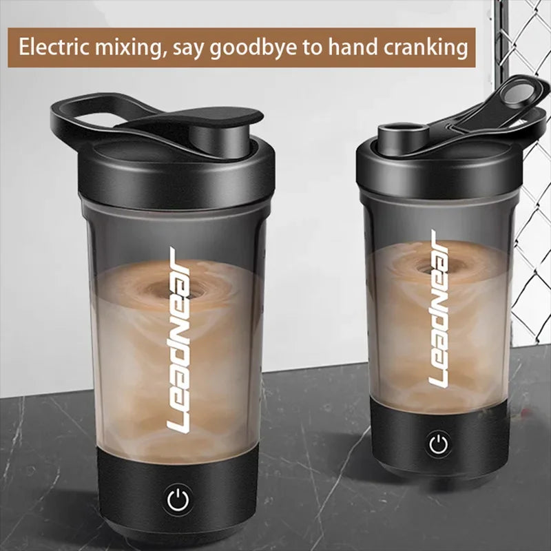 Two black portable electric blender bottles with power buttons mixing protein shakes