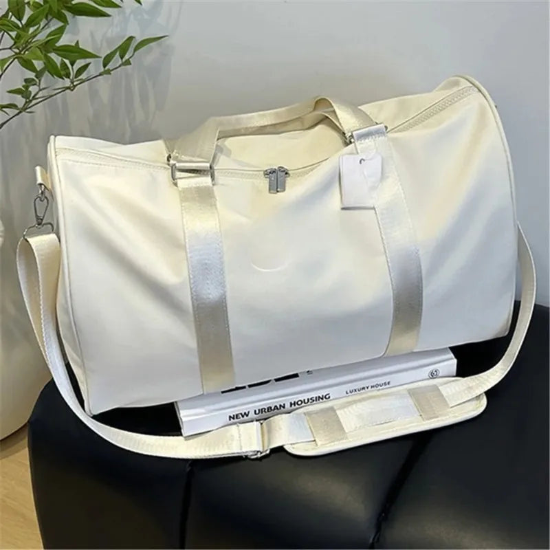 White urban travel gym bag with shoulder strap and side pockets