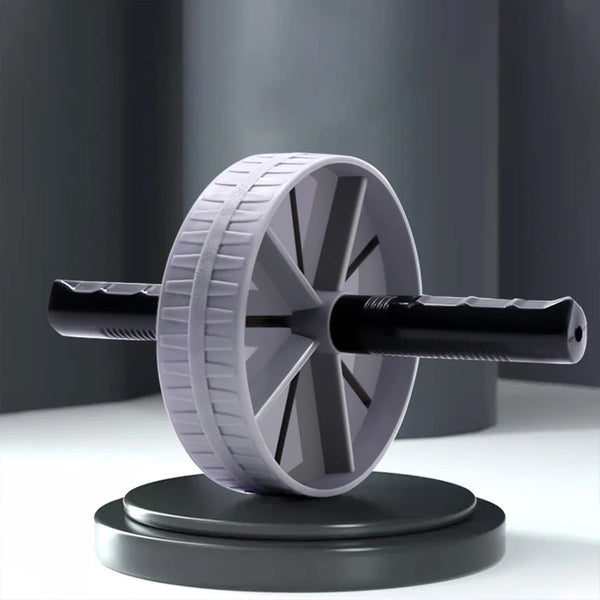 Gray ab roller wheel with textured tread and black foam handles displayed on platform showing stable wide-base design